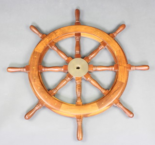 An 8 spoke teak and brass reproduction ships wheel 84cm