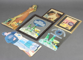 A Cool Sparkling Babycham advertising mirror with clock 43cm h x 30cm w, a rectangular Babycham advertising mirror contained in an oak frame 50cm x 40cm, 6 framed Babycham coasters and a small advertising poster "She said i'd love a Babycham" 30cm x 24cm and 2 cardboard cutouts of standing ladies 76cm h x  
