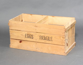 A wooden crate marked Eggs Fragile 33cm h x 70cm w x 33cm d 