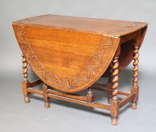 A Victorian carved light oak drop flap gateleg dining table raised on spiral turned supports 72cm h x 102cm l x 53cm w