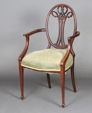 A mahogany Hepplewhite style open armchair with over stuffed seat 

