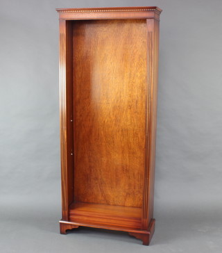 A Georgian style mahogany bookcase with moulded and dentil cornice, fitted adjustable shelves with fluted columns to the side, raised on bracket feet 182cm h x 76cm w x 28cm d 
