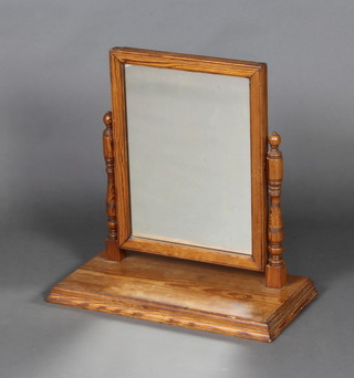 A Victorian plate dressing table mirror contained in a pine swing frame 51cm h x 52cm w x 27cm d 