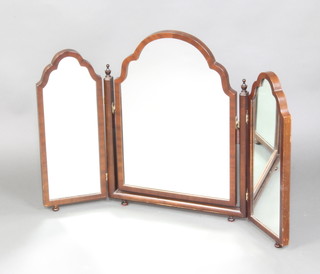 A Queen Anne style arched triple plate dressing table mirror contained in a mahogany frame, raised on bun feet 57cm h x 87cm w