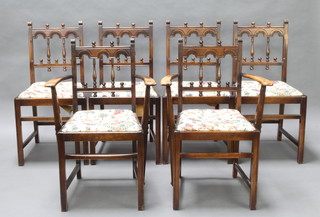 Ercol, a set of 6 beech stick and rail back dining chairs with upholstered drop in seats - 2 carvers, 4 standard  