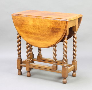 A light oak drop flap gateleg tea table raised on spiral turned supports 76cm h x 76cm w x 38cm when closed x 104cm l when open 