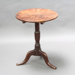 A 19th Century circular oak snap top tea/wine table raised on a turned column and tripod base 68cm h x 52cm diam. (signs of old but treated worm) 