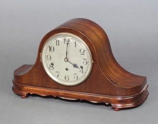 A 1930's chiming mantel clock with silvered dial and Arabic numerals contained in a mahogany  Admiral's hat shaped case 