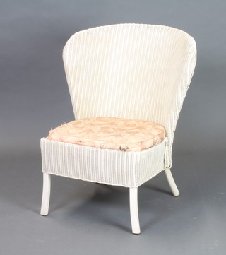 A white painted Lloyd Loom nursing chair 