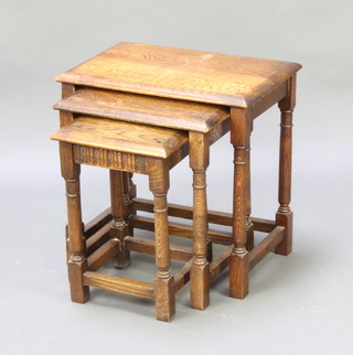 A nest of 3 rectangular oak interfitting coffee tables on turned and block supports 47cm h x 48cm w x 32cm d 