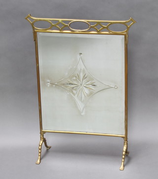 An Art Nouveau etched mirrored glass and brass fire screen 76cm x 52cm (silvering to the mirror is showing signs of deterioration) 