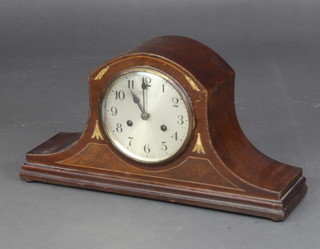 A mantel clock with silvered dial and Arabic numerals contained in a mahogany and brass inlaid Admirals hat shaped case
