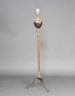 A copper and iron adjustable oil lamp stand converted to electricity 