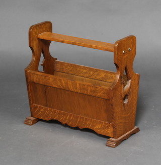 An oak twin compartment Canterbury with carved faun decoration 41cm h x 42cm w x 20cm d  