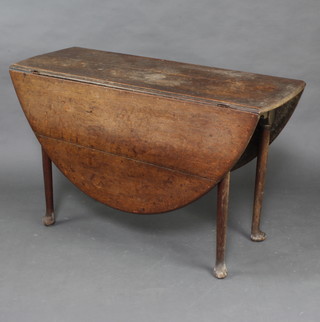 A Georgian oak drop flap oval dining table raised on club supports 71cm h x 117cm w x 44cm d 