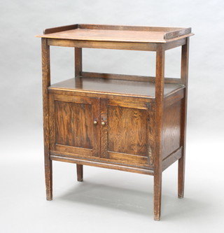 A rectangular oak buffet with three quarter gallery, recess and cupboard below enclosed by panelled doors 99cm h x 77cm w x 43cm d 