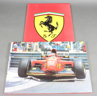 A print of a Ferrari logo and  another of Micheal Schumacher driving in a 1999 Ferrari No 27,  98cm w x 68cm h