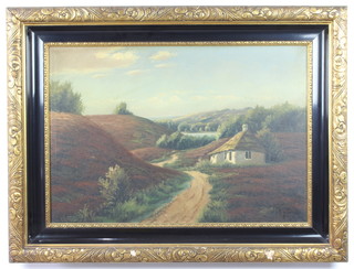 20th Century oil on canvas, indistinctly signed, a cottage in an extensive landscape 44cm x 25cm 