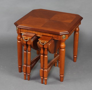 An American style cherry nest of 3 interfitting tables with crossbanded top, turned and reeded supports 50cm h x 57cm w 