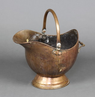 A 19th Century copper helmet shaped coal scuttle