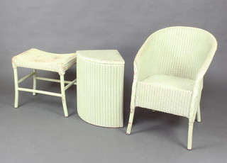 A light green Lloyd Loom chair, stool and laundry basket