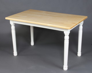 A pine finished and white painted kitchen table 74cm h x 124cm l x 77cm d