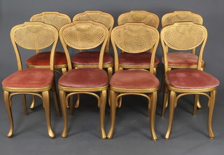 A harlequin set of 8 gilt bentwood banqueting style chairs ( 5 + 3 ) with woven cane backs on cabriole supports  