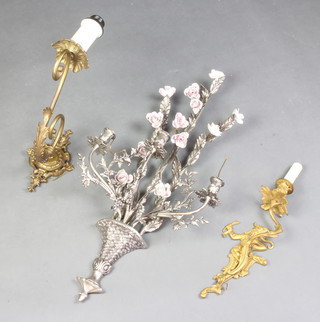 A Rococo style gilt metal wall light bracket supported by a figure of a gentleman 15cm h x 13cm w, a metal and porcelain 3 light wall bracket in the form of a basket of flowers 71cm x 35cm and a gilt metal wall light bracket
