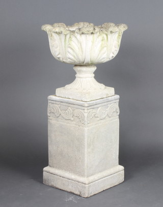 A well weathered circular concrete garden urn raised on a square base and associated square pedestal 97cm h x 49cm diam. (slight chip to base) 
