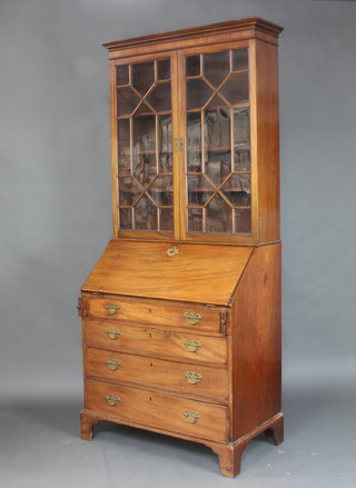 A Georgian mahogany bureau bookcase, the upper section with moulded cornice and fitted adjustable shelves, enclosed by astragal glazed doors, the fall front revealing a fitted interior above 4 long graduated drawers raised on bracket feet 215cm h x 91cm w x 50cm d