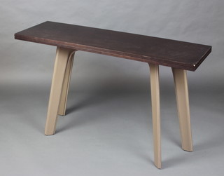 A hardwood top folding table on splayed leather covered legs 78cm x 130cm x 80cm (slight damage to folding hinge) 