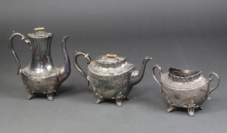 A Britannia metal 3 piece service comprising tea pot, coffee pot and 3 handles sugar bowl