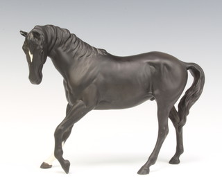 A Beswick figure of a race horse, black matt, 17cm (restored)