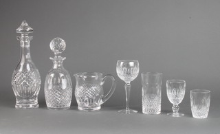 A Waterford Crystal club shaped decanter and stopper 32cm, a bulbous ditto 26cm, 3 hock glasses, 3 sherries, 3 liqueurs, 1 brandy balloon, 6 tumblers, 6 water glasses and a jug 
