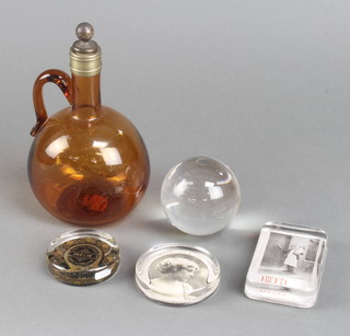 A 19th Century Continental amber coloured ewer and stopper 20cm, 3 glass paperweights and a glass ball 