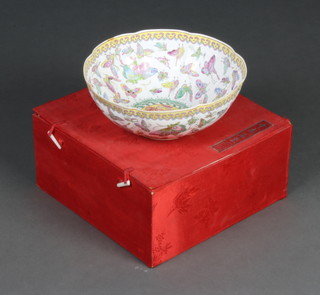 A circular Chinese bowl decorated a dragon and butterflies 25cm (cracked) boxed 