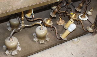 Three gilt metal light fittings and a rectangular embossed brass Canterbury 30cm x 39cm x 13cm 