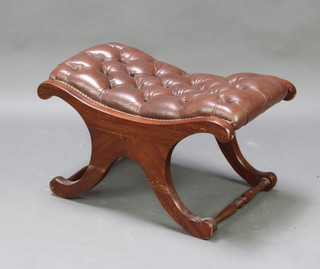 A Regency style mahogany X framed stool, the seat upholstered in buttoned brown leather 39cm x 68cm x 45cm (some damage to the side) 