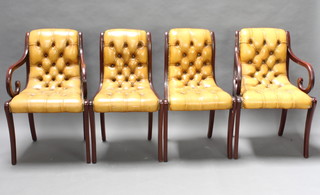 A set of 4 Georgian style mahogany dining chairs upholstered in mustard coloured leather - 2 carvers, 2 standard 