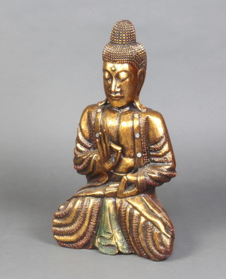 A gilt painted figure of a seated Buddha 60cm h x 35cm w x 15cm d