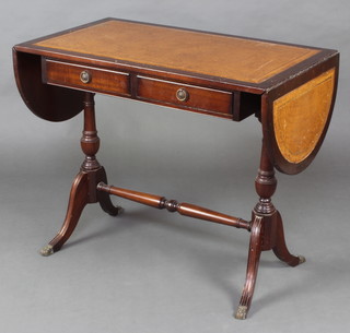 A Georgian style oval mahogany sofa table fitted 2 drawers, raised on turned supports 73cm h x 87cm w x 51cm d 