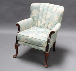 A Georgian style beech framed library chair upholstered in green floral material raised on cabriole supports 