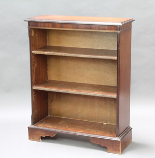 A Georgian style inlaid and crossbanded mahogany bookcase raised on bracket feet 94cm h x 76cm w x 28cm d 