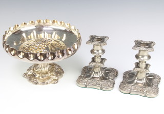 A silver plated repousse fruit bowl by Walker and Hall 14cm and a pair of ditto dwarf candlesticks 14cm 