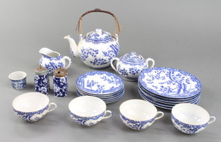 A Japanese tea set comprising a bulbous teapot, sugar bowl, cream jug, 4 tea cups, 6 saucers, 6 plates together with 2 condiments and a dish 