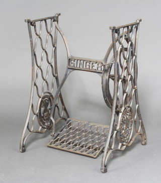A Singer treadle sewing machine on a cast iron base 72cm x 53cm x 30cm 