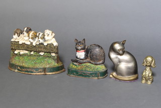 A cast iron doorstop in the form of a seated cat 16cm h x 19cm x 7cm, 1 other of 5 puppies 19cm x 30cm x 10cm, ditto seated dog 13cm x 4cm x 4cm and a bronzed figure of a seated cat 19cm x 13cm x 8cm  