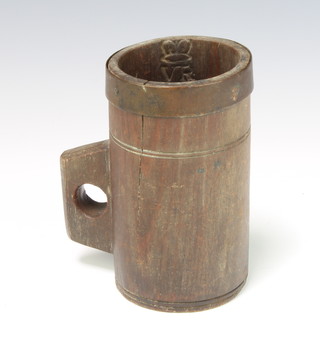 A Victorian coopered grain measure the interior with Royal Cypher and City of London crest, the base marked C Derby 15cm h x 9cm diam. (slight crack to side) 