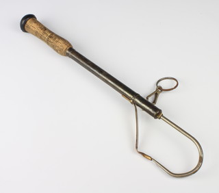 A brass 3 draw gaff with cork handle and net ring clip, a Mitchell 604 fishing reel, a centre pin fishing reel and a Fisherman 1500 reel 