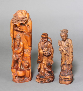 A Chinese carved hardwood figure of a standing sage 39cm x 10cm x 10cm together with 2 others 29cm x 7cm x 6cm and 16cm x 9cm x 9cm 